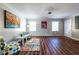 Well-lit living room with sleek floors, neutral tones, artwork, and stylish furniture for relaxation at 3626 Buford Ne Hwy # C2, Brookhaven, GA 30329