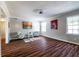 Cozy living area with wood-look floors, natural light from windows, and accent chairs for modern appeal at 3626 Buford Ne Hwy # C2, Brookhaven, GA 30329