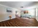 Bright living room showcasing wood-look floors, neutral walls, and tasteful decor with a glimpse into dining area at 3626 Buford Ne Hwy # C2, Brookhaven, GA 30329