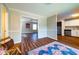 Open layout reveals combined living spaces with wood-look flooring, kitchen view, and neutral color at 3626 Buford Ne Hwy # C2, Brookhaven, GA 30329