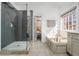 Modern bathroom featuring a glass shower, soaking tub, and sleek fixtures offers a luxurious experience at 6119 Fairlong Nw Run, Acworth, GA 30101