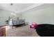 Finished basement bedroom with carpeted floors and a black metal bed frame at 6119 Fairlong Nw Run, Acworth, GA 30101