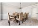 Formal dining room with chandelier, wainscoting, and seating for eight at 6119 Fairlong Nw Run, Acworth, GA 30101