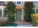 Close up of the home's front door framed by lush landscaping at 6119 Fairlong Nw Run, Acworth, GA 30101
