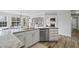 Modern kitchen featuring granite countertops, stainless steel appliances, and light wood flooring at 6119 Fairlong Nw Run, Acworth, GA 30101