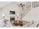 Bright living room with vaulted ceiling, fireplace, and staircase at 6119 Fairlong Nw Run, Acworth, GA 30101