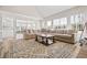Spacious living room featuring a large sectional couch, fireplace, and open floor plan at 6119 Fairlong Nw Run, Acworth, GA 30101