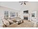 Inviting living room with fireplace, large windows, and plush seating at 6119 Fairlong Nw Run, Acworth, GA 30101
