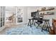 Home office with built-in shelving, desk, and sliding doors at 6119 Fairlong Nw Run, Acworth, GA 30101