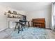 Office with a piano and desk, featuring ample natural light and blue rug at 6119 Fairlong Nw Run, Acworth, GA 30101