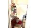 Cozy bathroom featuring granite counters, a shower-tub combo, and convenient metal storage racks at 9400 Roberts Dr # 7M, Atlanta, GA 30350