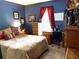 Well-lit bedroom features a comfortable bed and ample storage space at 9400 Roberts Dr # 7M, Atlanta, GA 30350