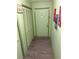 Hallway with wood look floors, a sage green color scheme, closet and front door at 9400 Roberts Dr # 7M, Atlanta, GA 30350