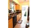 Updated kitchen area featuring granite countertops and wood-look flooring at 9400 Roberts Dr # 7M, Atlanta, GA 30350