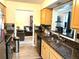 Functional kitchen boasting granite countertops and stainless steel appliances at 9400 Roberts Dr # 7M, Atlanta, GA 30350