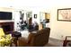 Inviting living room featuring a cozy fireplace and lots of natural light at 9400 Roberts Dr # 7M, Atlanta, GA 30350