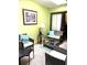 Comfortable sunroom with plenty of natural light and cozy seating arrangements at 9400 Roberts Dr # 7M, Atlanta, GA 30350