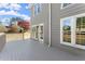 Back deck with grey wood flooring, railings, and access to the home's exterior at 13090 Magnolia Crescent Dr, Roswell, GA 30075