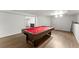 Basement game room with laminated floors, recessed lighting and professional pool table at 13090 Magnolia Crescent Dr, Roswell, GA 30075