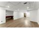 Open basement area with laminated floors, recessed lighting and bonus game room at 13090 Magnolia Crescent Dr, Roswell, GA 30075