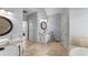 Large bathroom featuring a vanity and easy access to the bedroom and walk-in tub at 13090 Magnolia Crescent Dr, Roswell, GA 30075