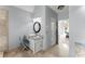 Well-lit bathroom showcasing stylish vanity and access to the bedroom at 13090 Magnolia Crescent Dr, Roswell, GA 30075