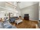 Open living space with hardwood floors, a large window, and views of the second floor at 13090 Magnolia Crescent Dr, Roswell, GA 30075