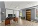 Office features neutral walls, vinyl flooring, built-in bookshelf and a storage closet at 13090 Magnolia Crescent Dr, Roswell, GA 30075