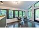 Bright bar area with seating and ample natural light from a wall of windows at 4052 Loch Highland Ne Pass, Roswell, GA 30075
