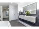 Bright bathroom featuring a double vanity with stylish fixtures and a large mirror at 4052 Loch Highland Ne Pass, Roswell, GA 30075