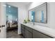 Modern bathroom vanity featuring stone countertop, drawers for storage and a large mirror at 4052 Loch Highland Ne Pass, Roswell, GA 30075