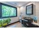 Unique bathroom featuring tire sink, white tile walls, and a large window with a view of trees at 4052 Loch Highland Ne Pass, Roswell, GA 30075