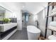 Modern bathroom featuring a soaking tub, a double sink vanity, and a walk-in shower at 4052 Loch Highland Ne Pass, Roswell, GA 30075