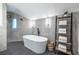 Modern bathroom with a soaking tub and tiled walk-in shower; bright and luxurious at 4052 Loch Highland Ne Pass, Roswell, GA 30075