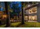 Striking two-story home with modern design, floor to ceiling windows, and an inviting outdoor living space at 4052 Loch Highland Ne Pass, Roswell, GA 30075