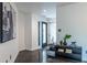 Bright foyer with concrete floors, a modern console table, and stylish artwork at 4052 Loch Highland Ne Pass, Roswell, GA 30075