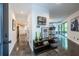 Contemporary foyer with polished concrete floors, modern shelving, and an open view into the living room at 4052 Loch Highland Ne Pass, Roswell, GA 30075
