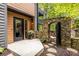 Welcoming front entrance featuring a stone archway, wood accents, and a stylish black-trimmed door at 4052 Loch Highland Ne Pass, Roswell, GA 30075