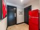 Hallway featuring a retro-style red refrigerator near the doorway at 4052 Loch Highland Ne Pass, Roswell, GA 30075