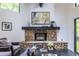 A stone fireplace creates a cozy focal point in this modern living area at 4052 Loch Highland Ne Pass, Roswell, GA 30075