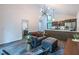 Bright living room boasts modern lighting and a view of the trees at 4052 Loch Highland Ne Pass, Roswell, GA 30075