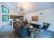 Open-concept living room with modern lighting, contemporary decor, and a view of the trees at 4052 Loch Highland Ne Pass, Roswell, GA 30075