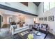 Bright living room featuring high ceilings, a modern sofa, and stylish decor at 4052 Loch Highland Ne Pass, Roswell, GA 30075