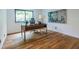 Bright home office with hardwood floors and a sleek desk with a nature view at 4052 Loch Highland Ne Pass, Roswell, GA 30075