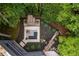Overhead view of outdoor living space featuring a stone fireplace and a cozy lounge area at 4052 Loch Highland Ne Pass, Roswell, GA 30075
