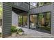 Enjoy seamless indoor-outdoor living with sliding glass doors to the outdoor fireplace and patio at 4052 Loch Highland Ne Pass, Roswell, GA 30075