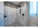 Modern shower with neutral tile and a sleek black shower head; bright and clean at 4052 Loch Highland Ne Pass, Roswell, GA 30075