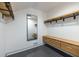 Neat walk-in closet featuring custom wood shelving and drawers, with a mirror at 4052 Loch Highland Ne Pass, Roswell, GA 30075