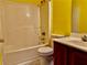 Bright bathroom featuring a shower-tub combo and single sink vanity with marble-look vinyl flooring at 4842 Hairston Park Sq, Stone Mountain, GA 30083