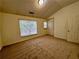 Carpeted bedroom with a window with blinds, walk-in closet and a neutral color scheme at 4842 Hairston Park Sq, Stone Mountain, GA 30083